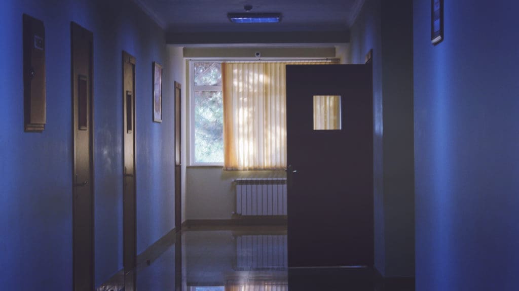 image of empty hospital hall at night for blog post on how to get through a nightshift