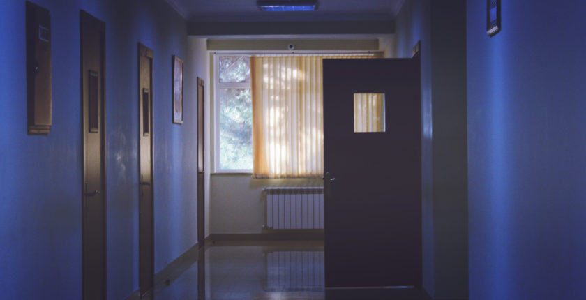 image of empty hospital hall at night for blog post on how to get through a nightshift